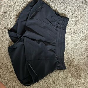 Size 4 black lululemon hotty hot shorts